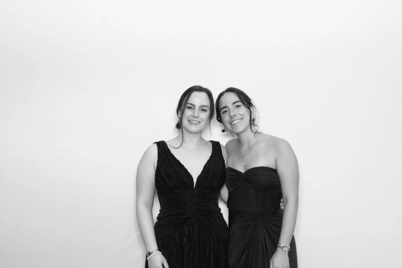 NYC glamour photo booth black and white portrait of two women in formal gowns at a black-tie event
