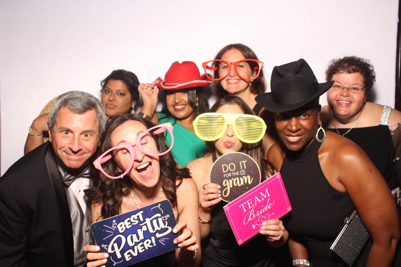 NYC wedding photo booth large group photo with team bride and best party ever props